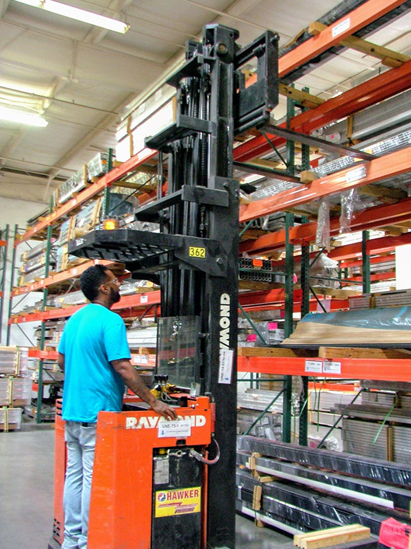 Employee operating forklift