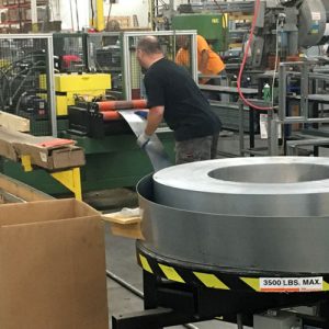 Employee working with metal