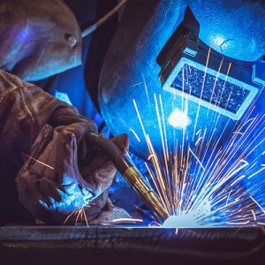 Employee welding close up